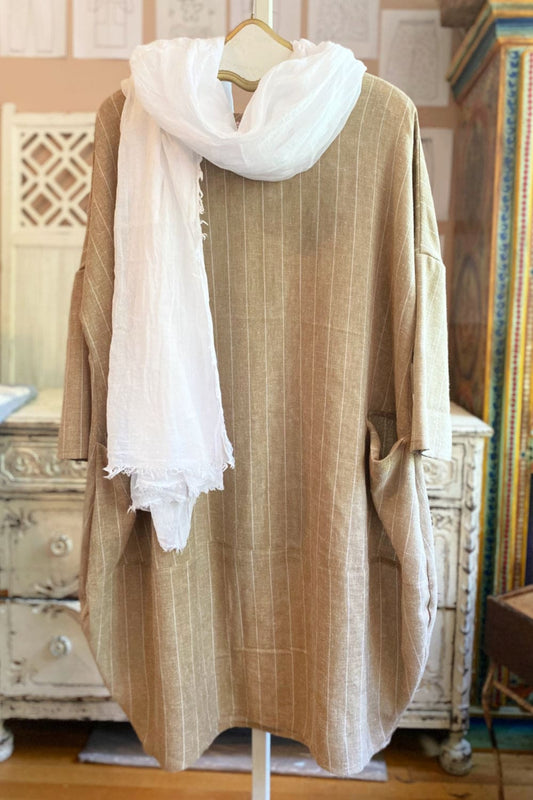 Beige Linen bubble dress with white pinstripes and accessoriezed with a white scarf