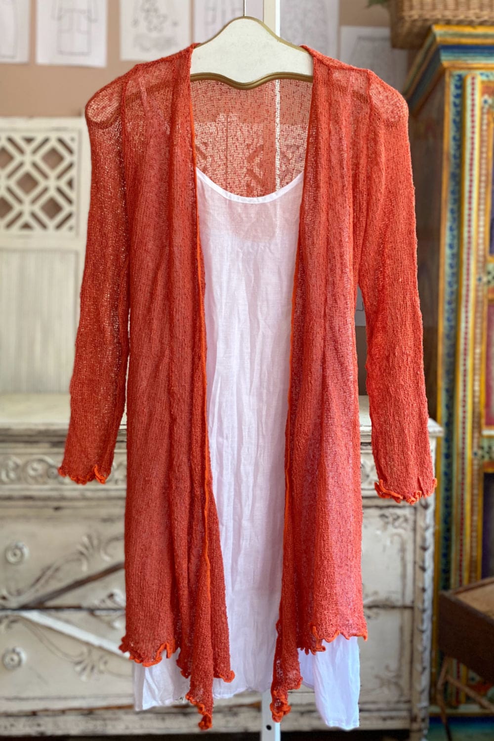 Reddish long sleeve knit duster.