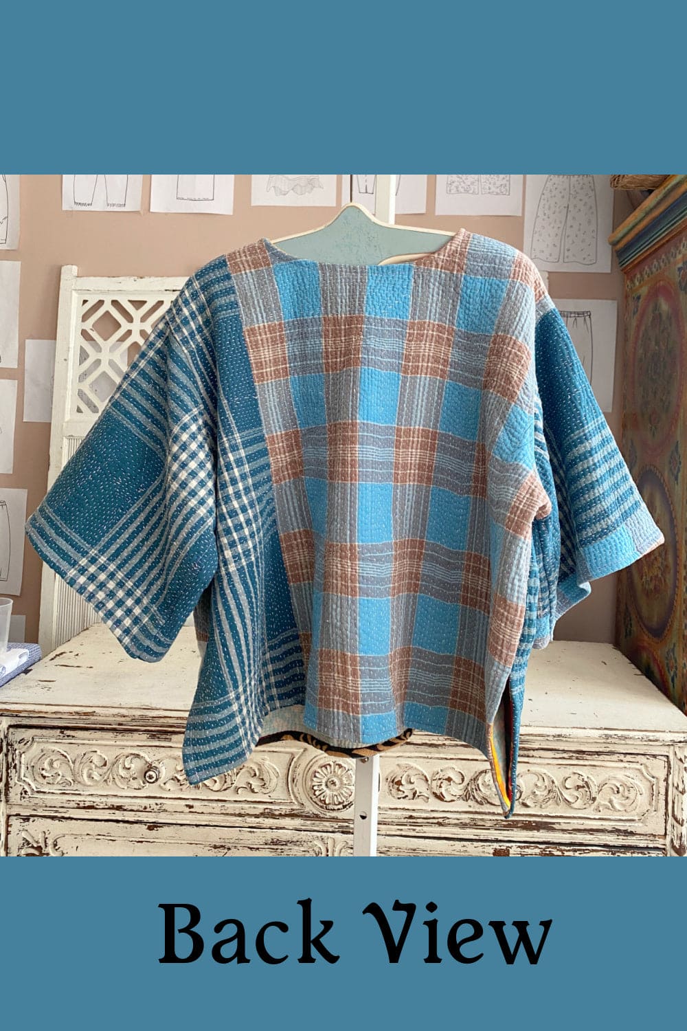 Back view of blue plaid women's kantha cotton pullover.