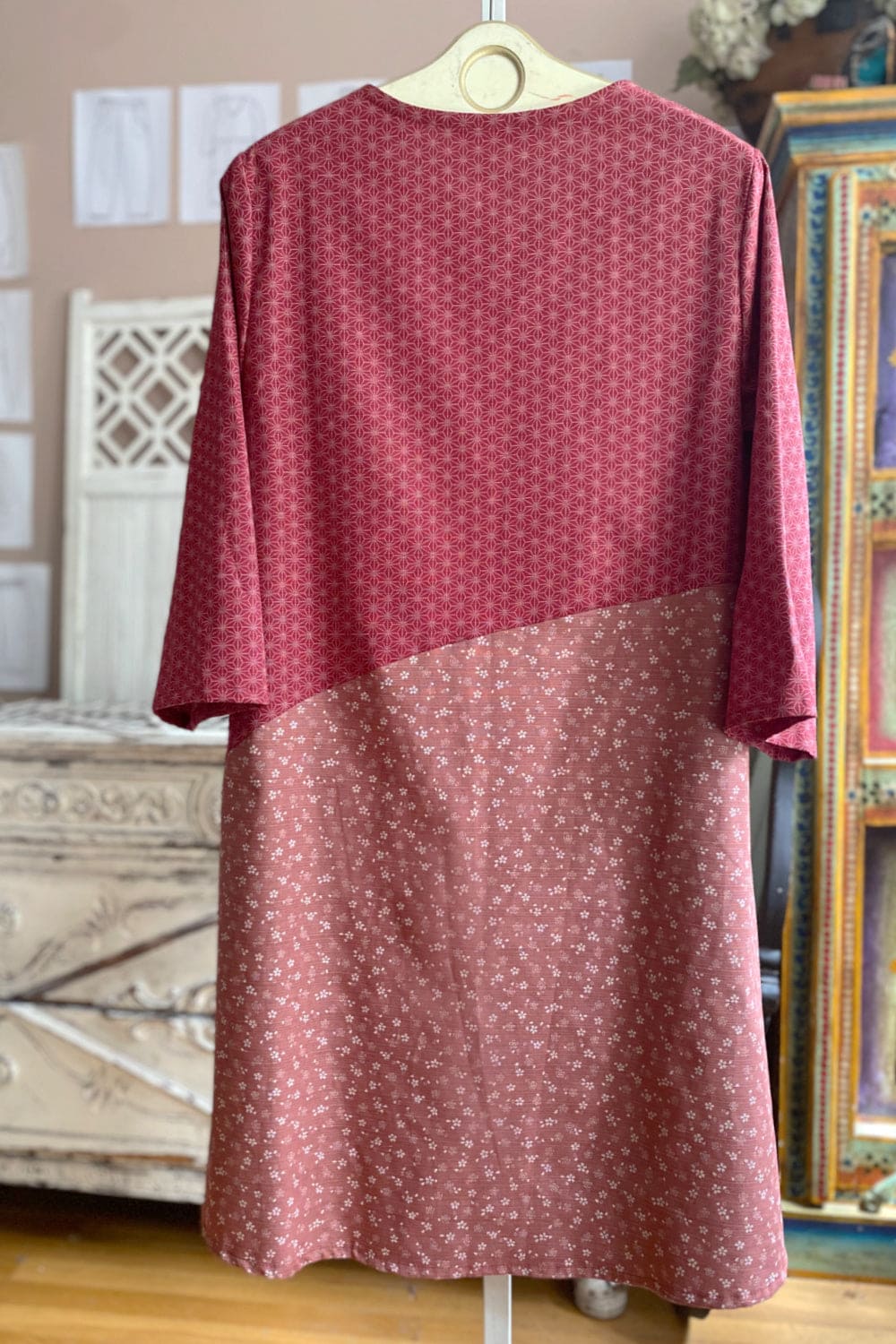 Back view of soft rose colored tunic dress.