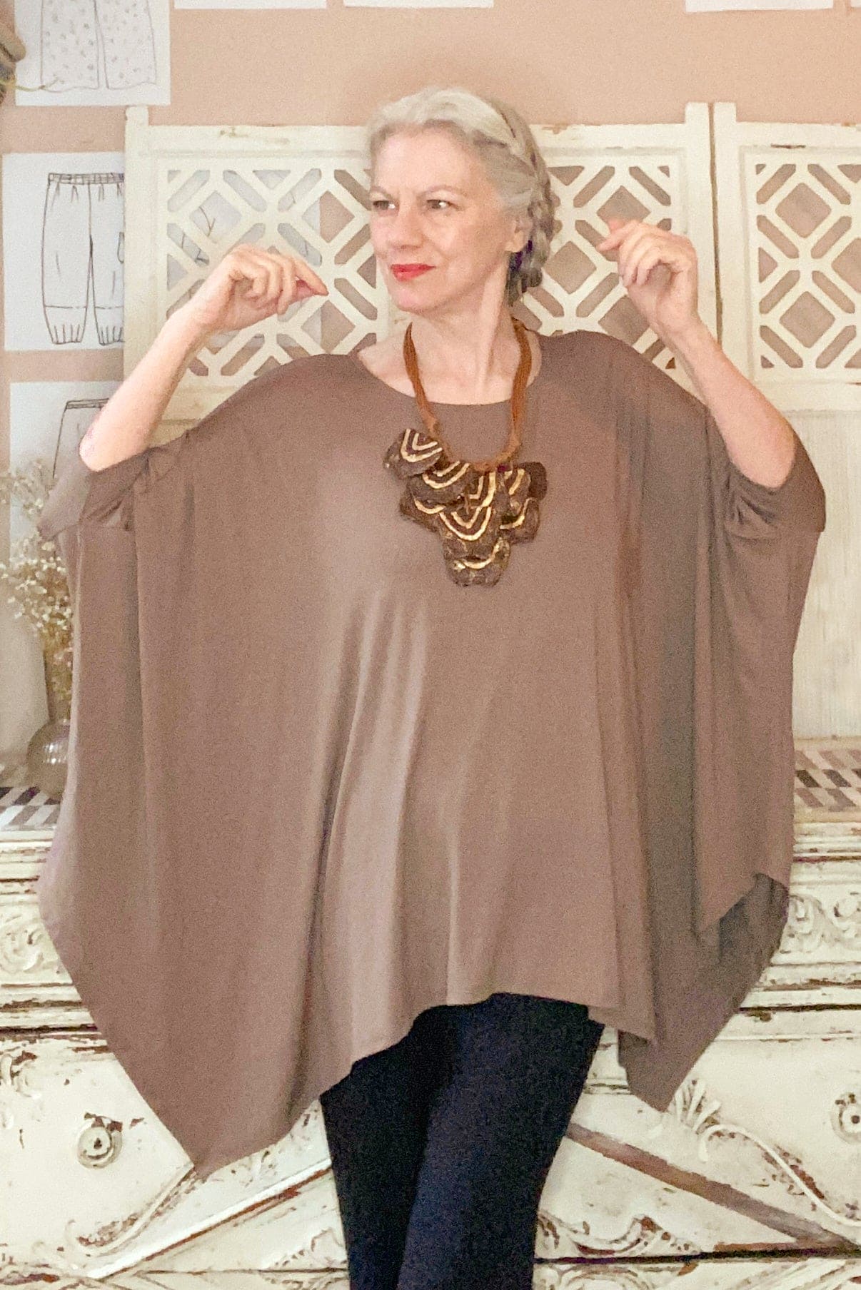 Roomy and dramatic mocha colored bamboo tunic with black bamboo pants and handmade paper mache necklace.