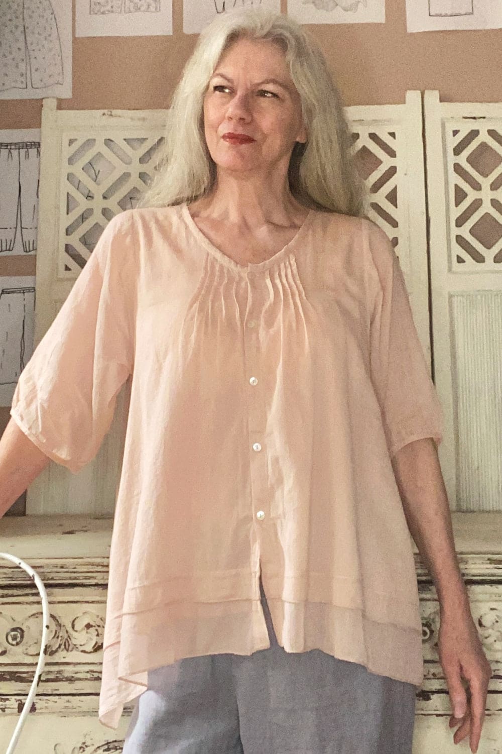 Lightweight cotton aline blouse with pearl buttons in a pretty blush color.
