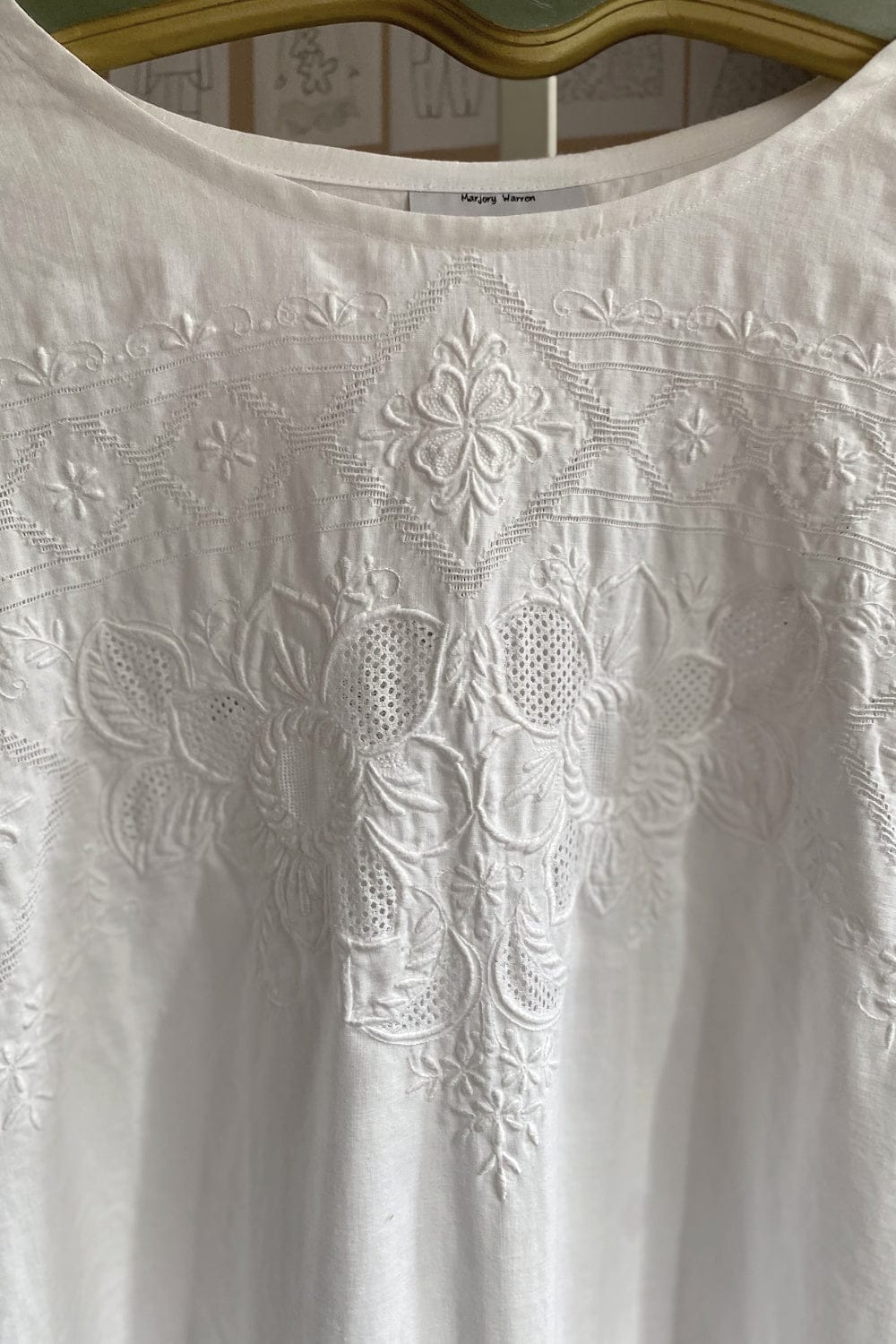 Close up of vintage tablecloth dress neckline and delicate stitching detail.