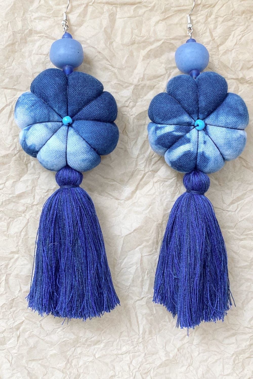 Handcrafted tassel earrings tie dye blue.