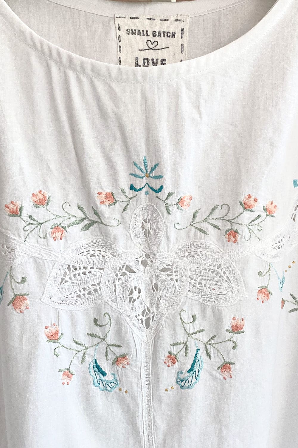 Front closeup of White cotton delicate floral Bubble Dress made of vintage tablecloth