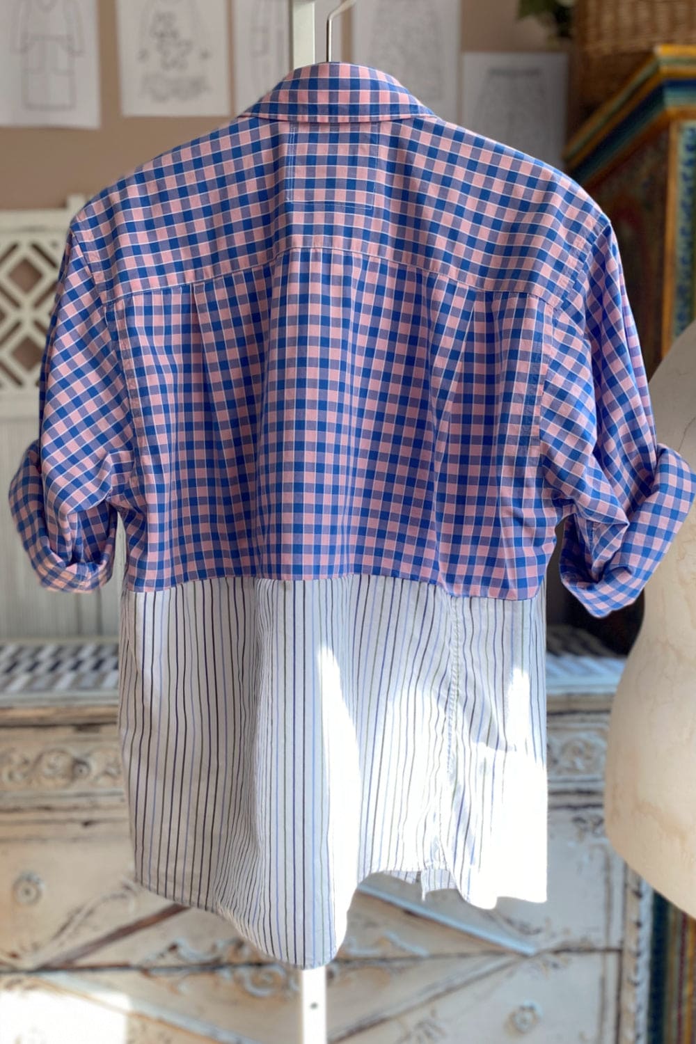 Back view of Women's shirt with collar, rolled up sleeves with pattern and color combination.