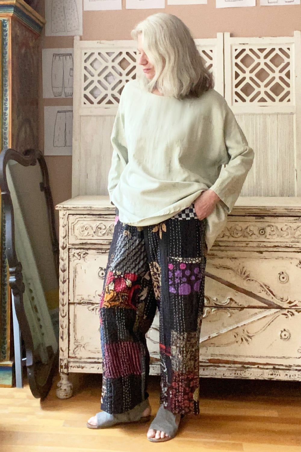 Fun patchwork kantha pants with lots of prints and colors on a black background.