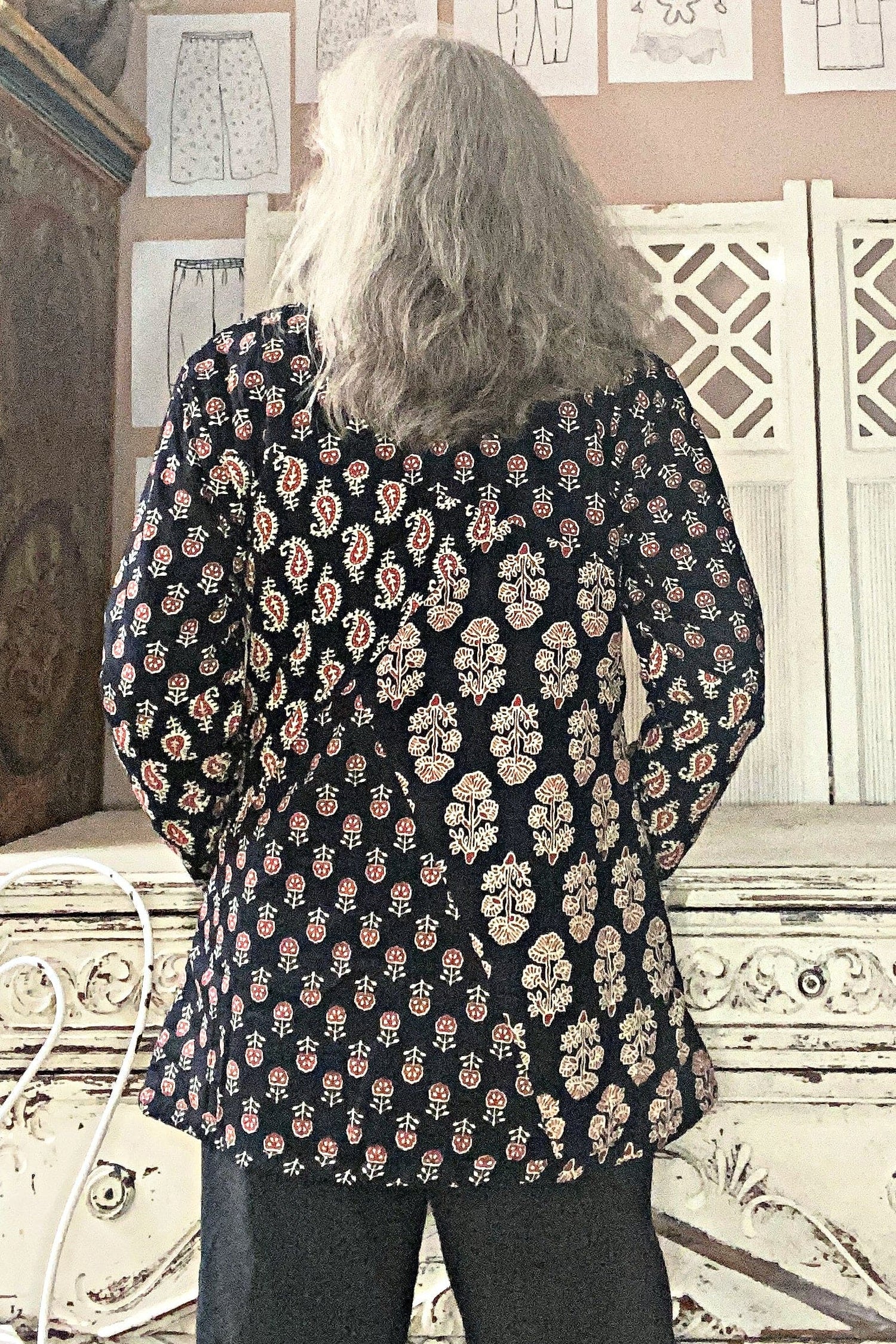 Back view of Multi Print cotton coat with 2 front pockets in ivory, cranberry on black background.