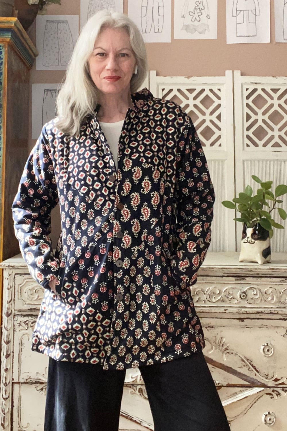 Longer Blockprint jacket with two hip pockets worn on woman with long grey hair.