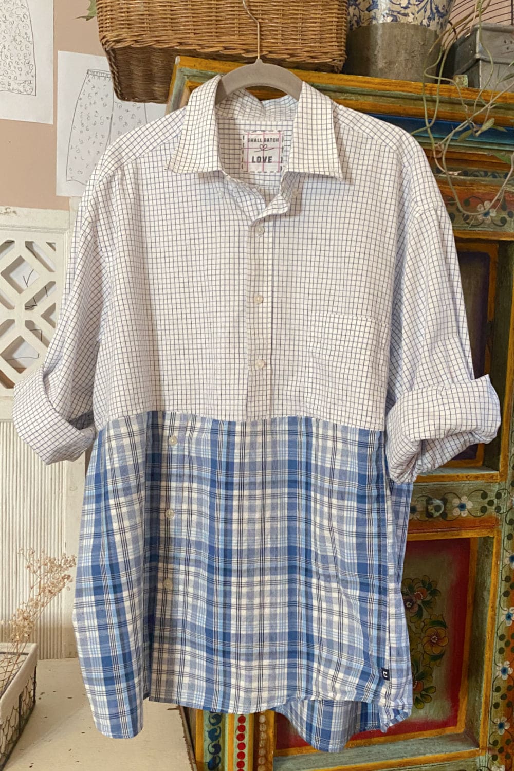 Button down shirt with two pattens of blue check and plaid.