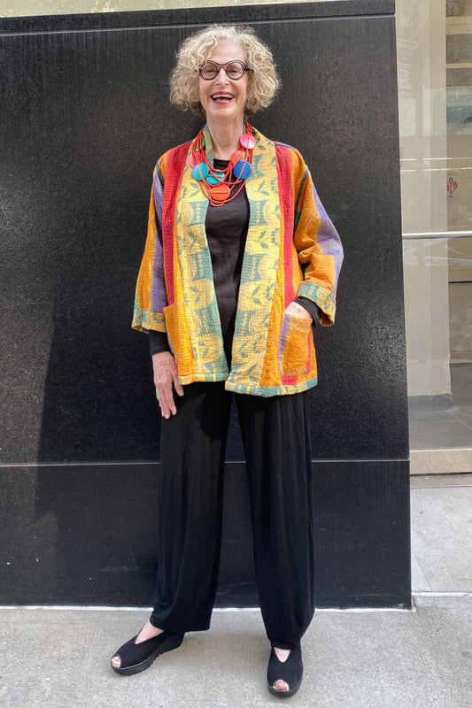 Colorful Cotton Kantha Jacket worn with a fun statement necklace.
