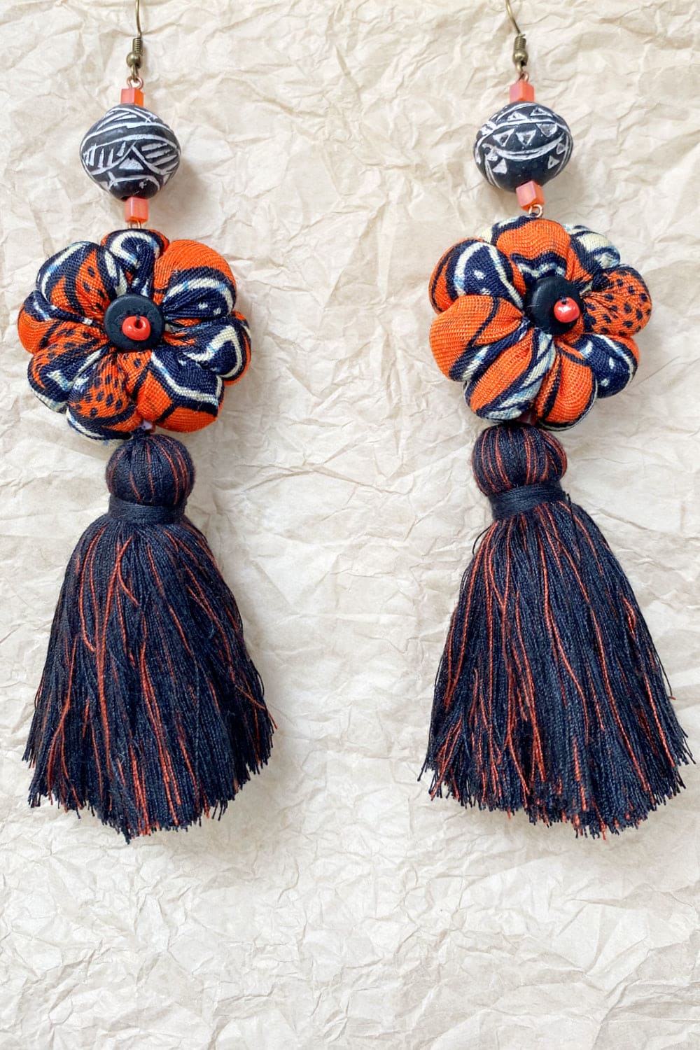 Handcrafted tassel earrings black and orange.