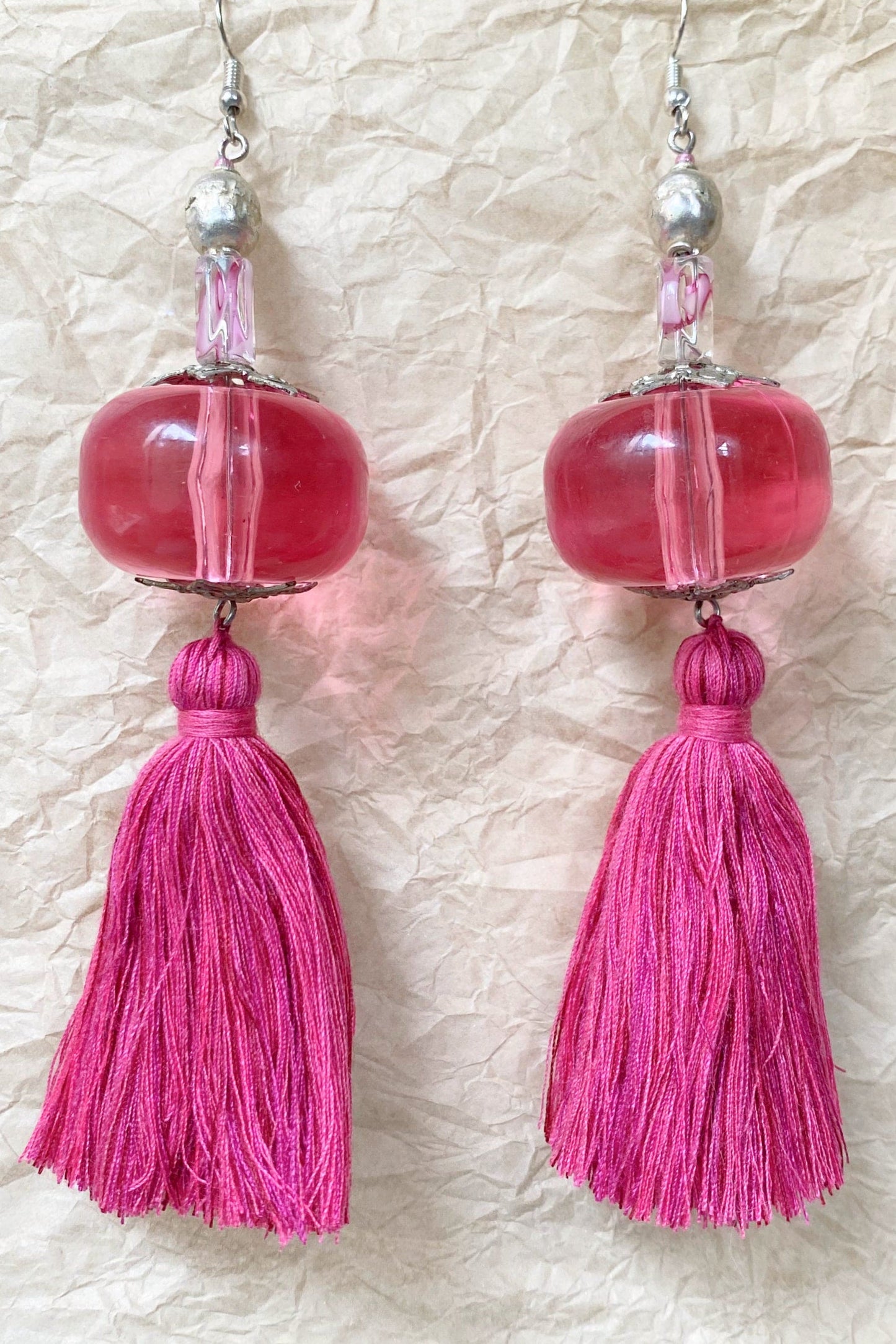 Handcrafted tassel earrings pink bead and tassel.