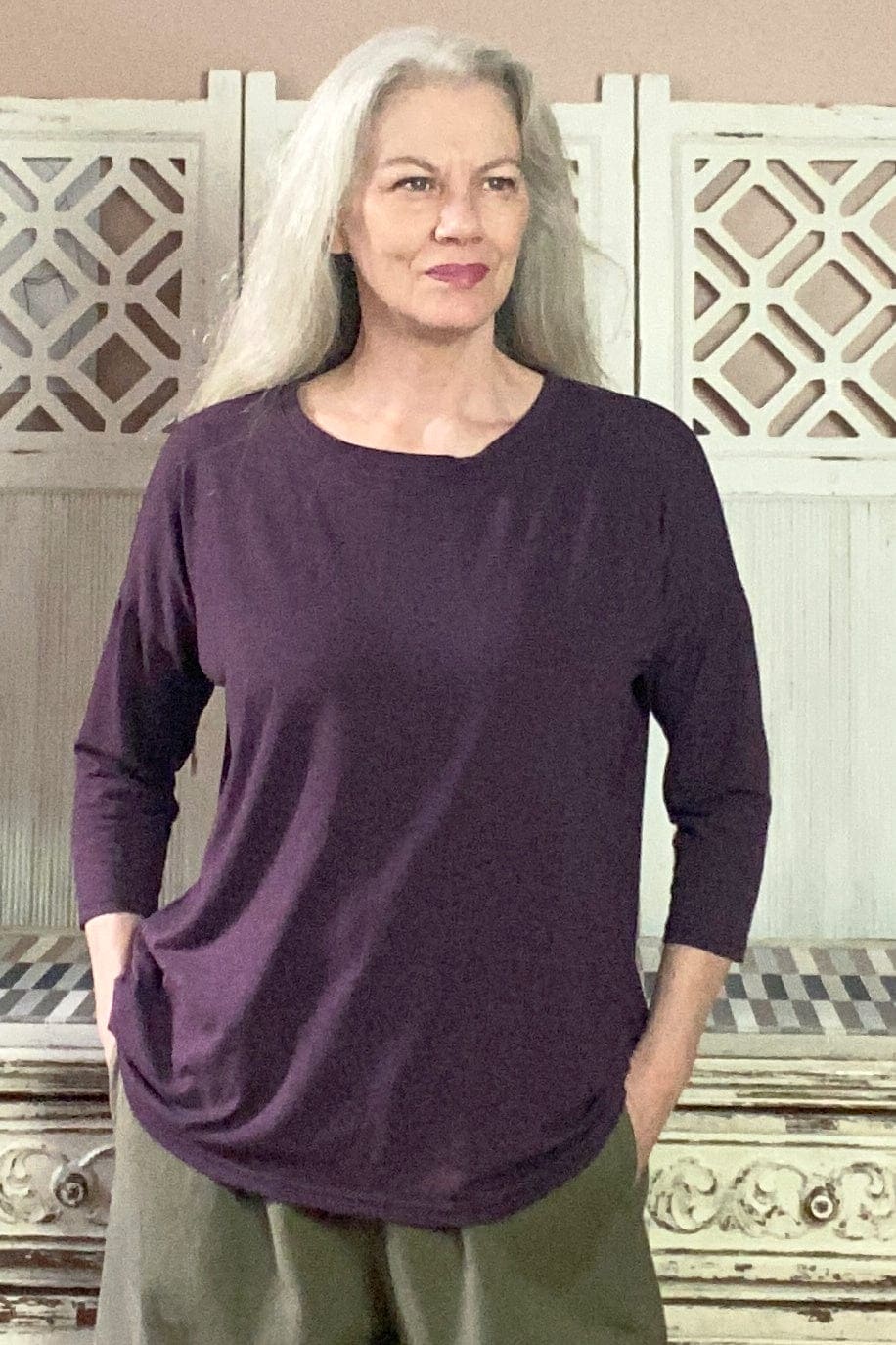 Deep purple three quarter sleeve jersey knit top.