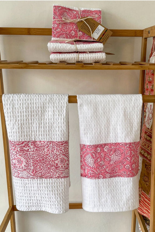 White Cotton tea towels decorated with red hand blocked patterns