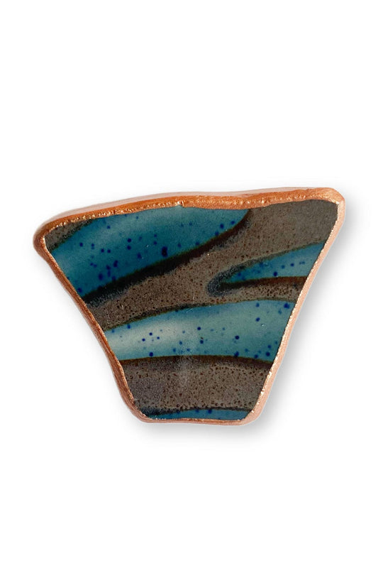 Striated pattern upcycled china plate pin.