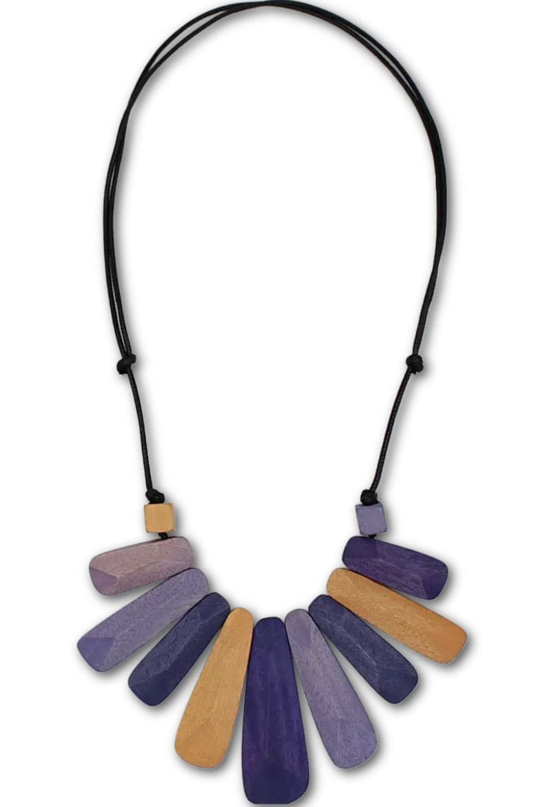 Wooden pendant necklace is pruples and browns strung on an adjustable black cord.