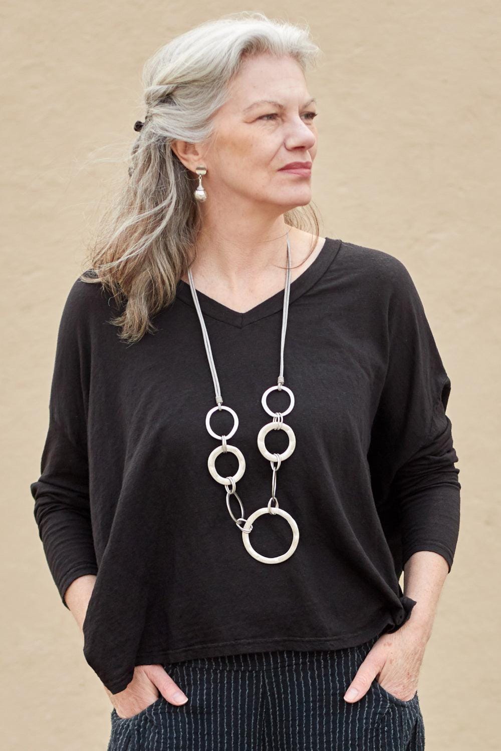 Hoop Necklace styled with a long sleeve loose fit black sweater.