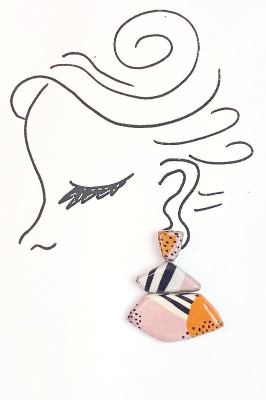 Three Tier Decoupage Desing Earrings decorated with pink, orang, black and white colors. Solids, stripes and dots decorate these earrings. Unique geometric shaped flat wooden beads.