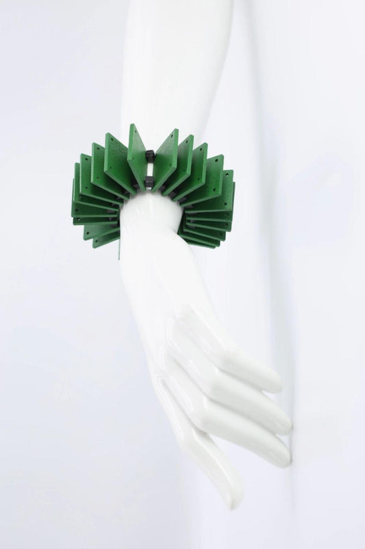 Green wooden square bracelet is very bold a graphic looking.