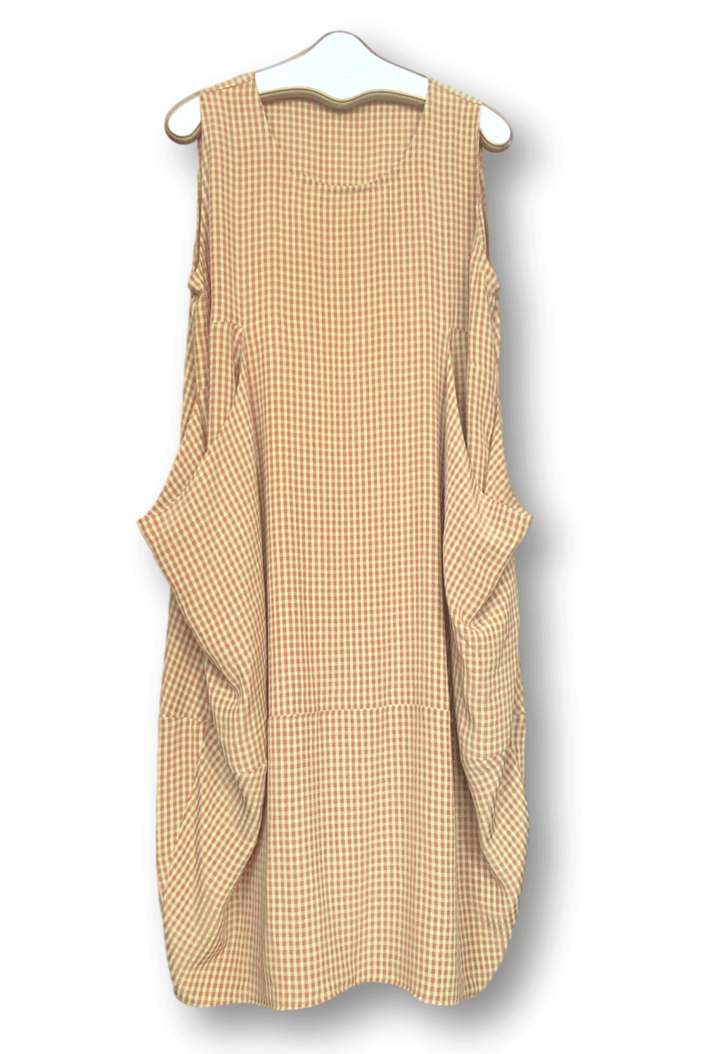 Women's summer dress hanging on a hanger. It is a slight bubble shapem tank with two large front pockets. The fabric is a baby check pattern.
