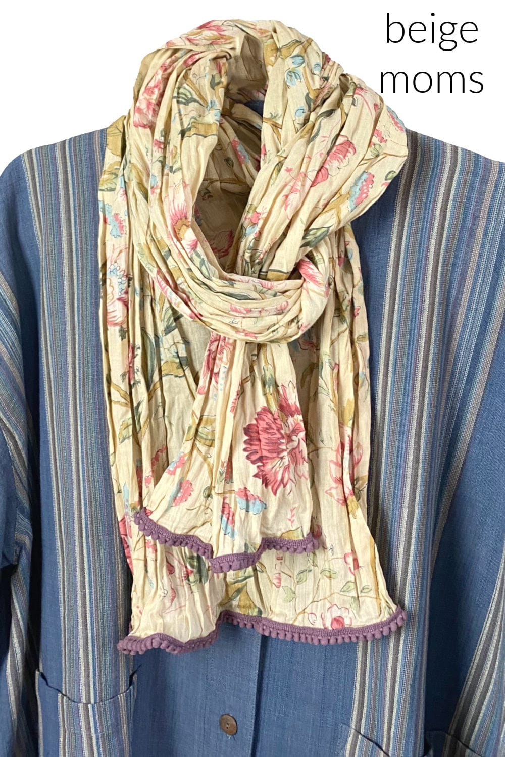 Pretty cotton scarf with a pale beige color way with floral print. Edges are trimmed little textured trim.