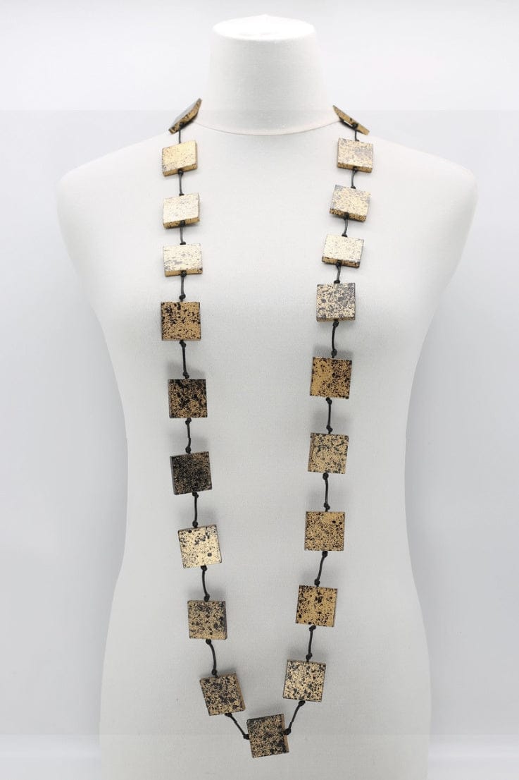Black & Gold recycled wood necklace made of flat square wooden beads strung on black cord.