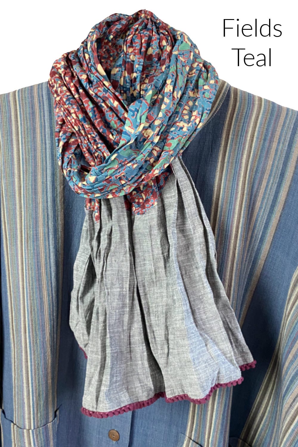 Pretty cotton scarf with a scattered print and grey accent. Edges are trimmed little textured trim.