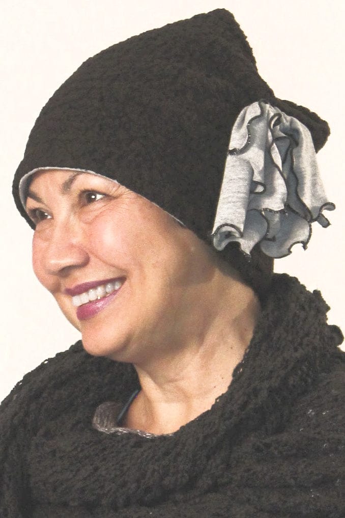 Soft women's black winter hat with grey side bow.