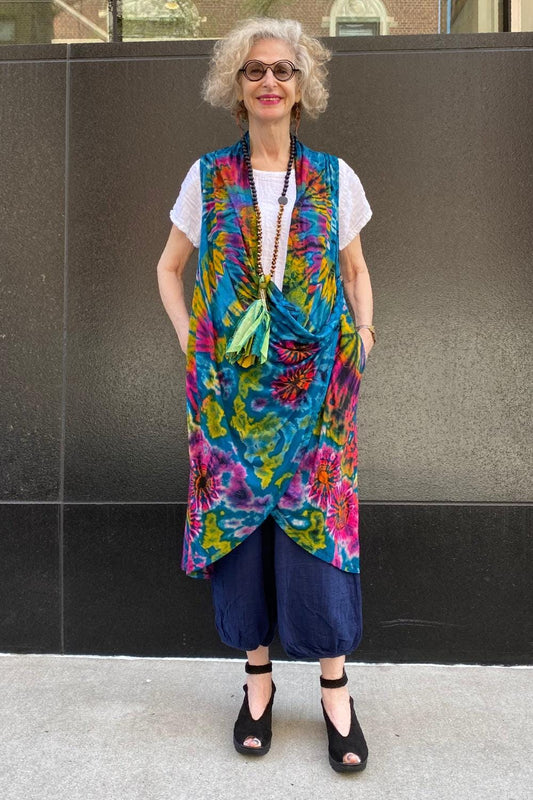 Teal Dramatic Tie Dye Vest with a drape front worn on a smiling woman.