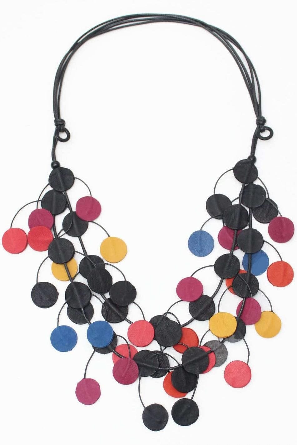 Multi Leather Dots in assorted colors Necklace designed with small flat leather discs intertwining and strung on an adjustable black cord.