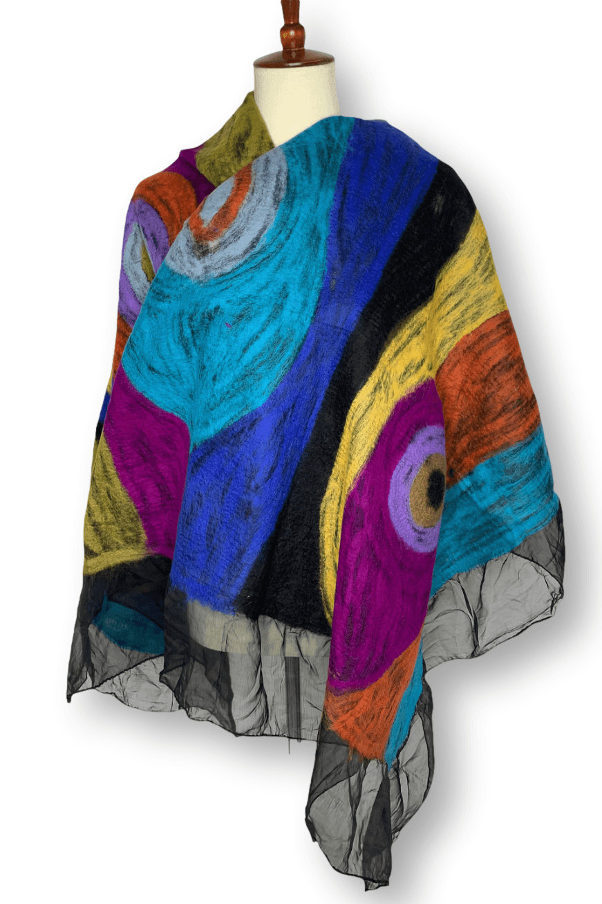 Multi jewel colored felted wool wrap with black accents wrapped around a dress form.
