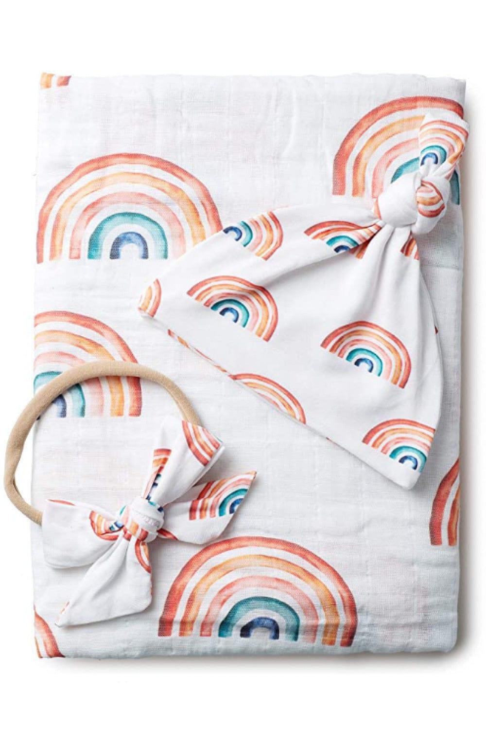 Rainbow baby swaddling blanket with matching newborn hat and bow.