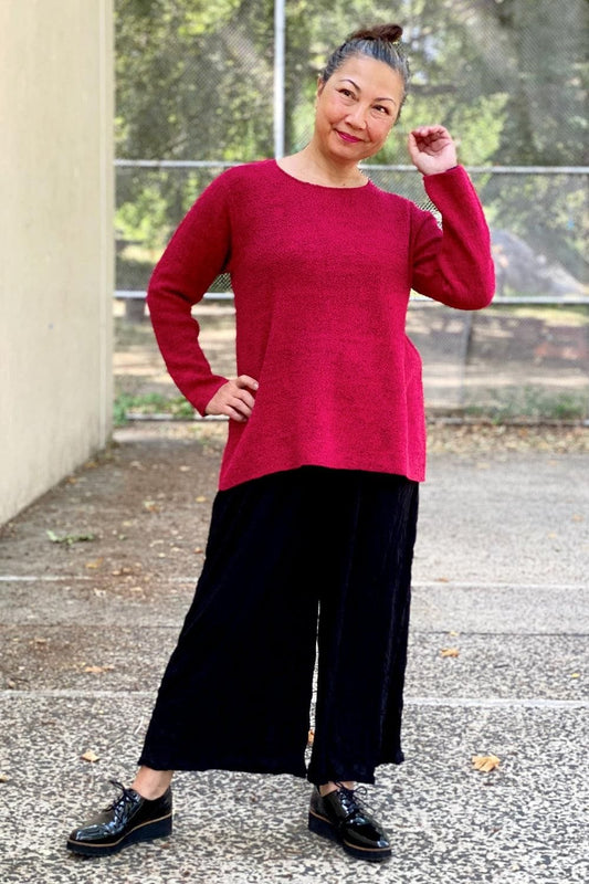 Raspberry Cotton Sweater worn with full cut wide leg black pants. 
