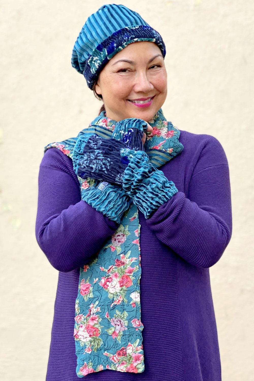 Woman's winter velvet hat reversible floral and stripe looks cute with velvet cuff gloves and reversible scarf.