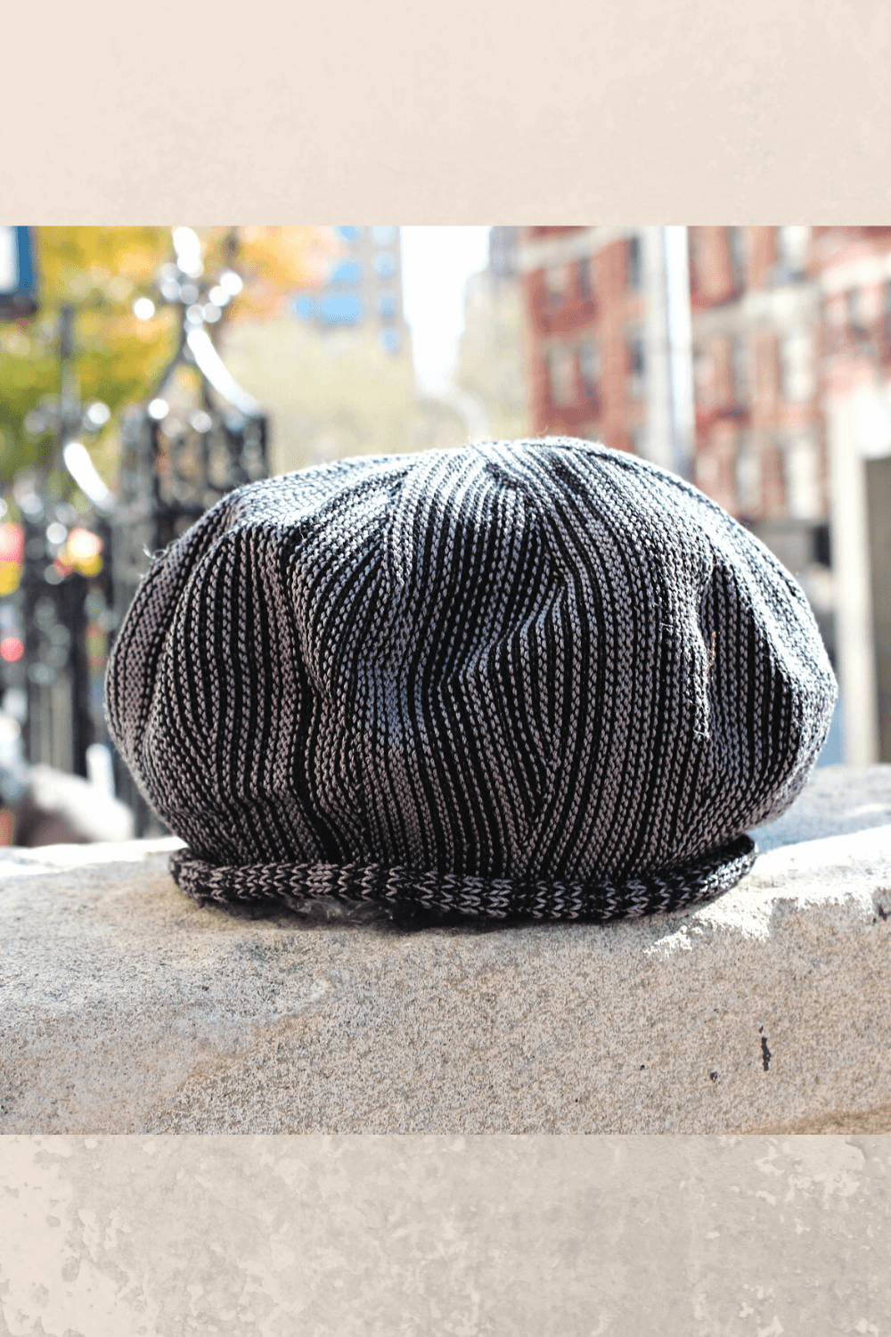 Hand knit Cotton tam in brown black stripe colorway.