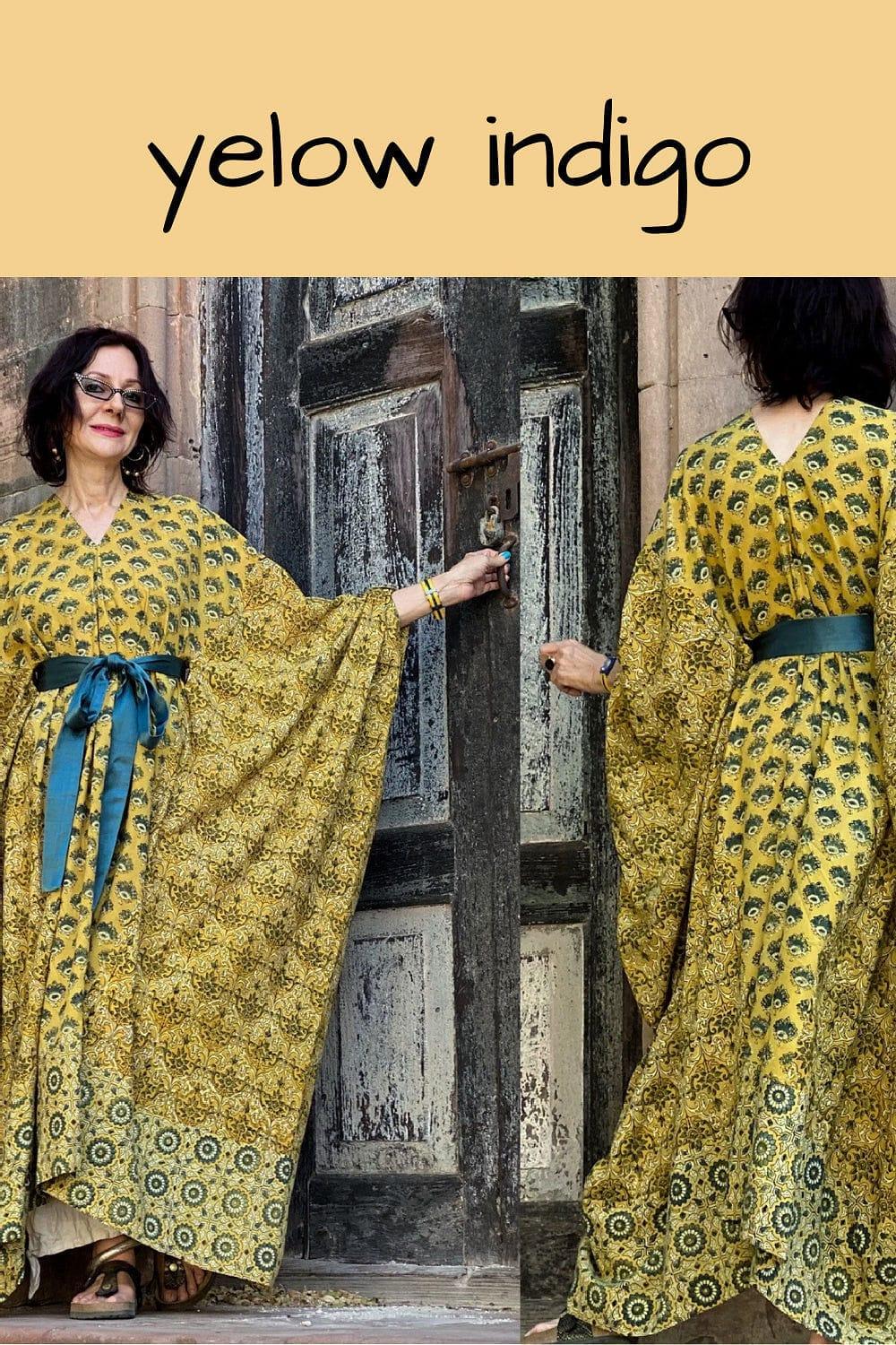 Handprinted Indian Cotton Kaftan in a mixture of colors and patterns. A tied silk sash is bowed just above the waist. 