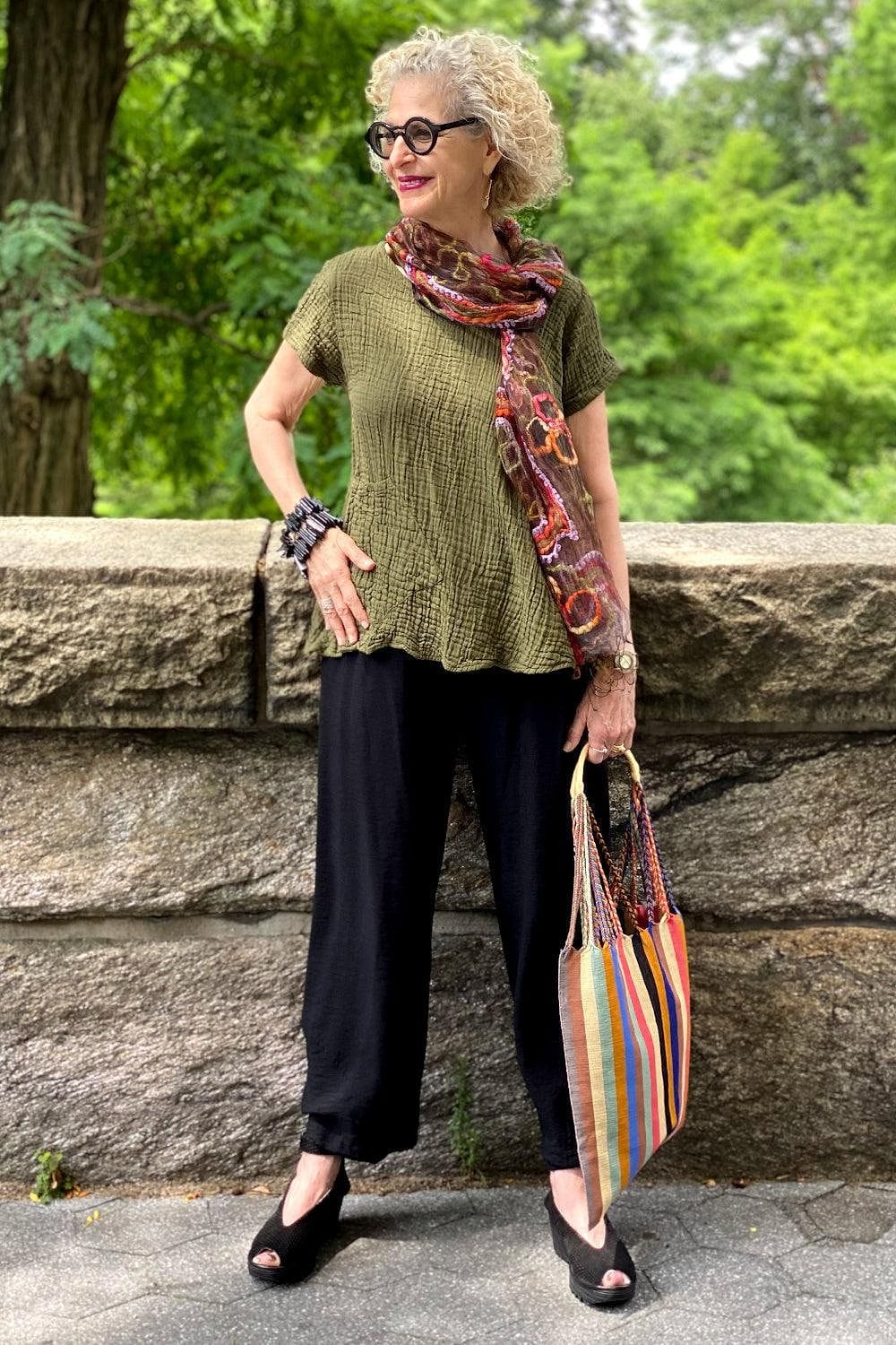 Olive Women's Cotton aline top with short sleeves. Styled with a scarf, bracelet and woven tote bag.
