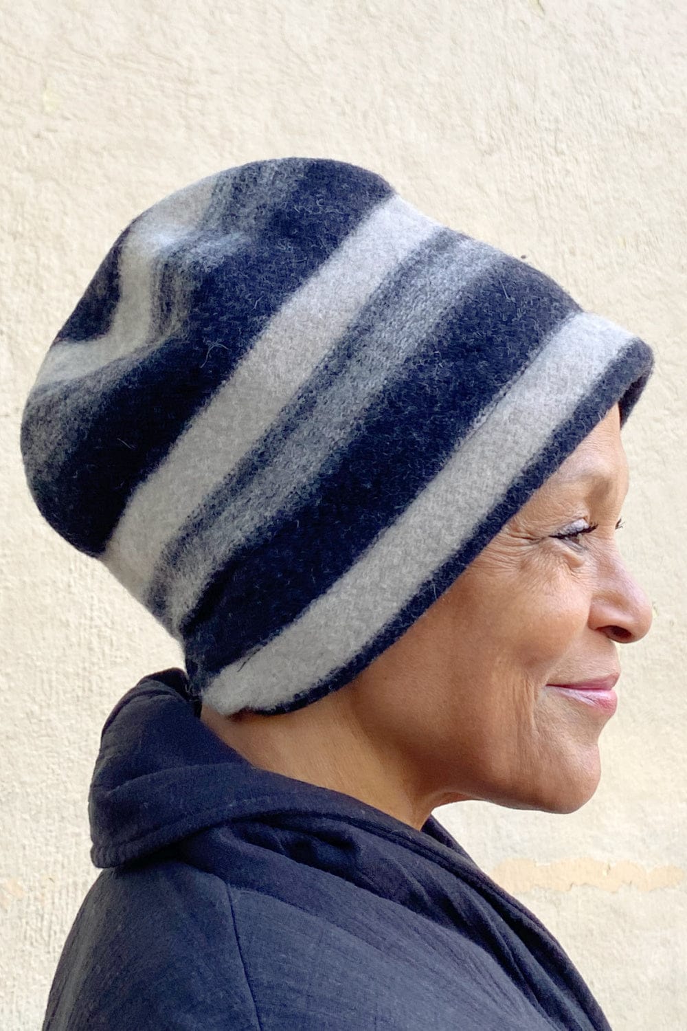 Black and greyish striped merino wool woman's hat.